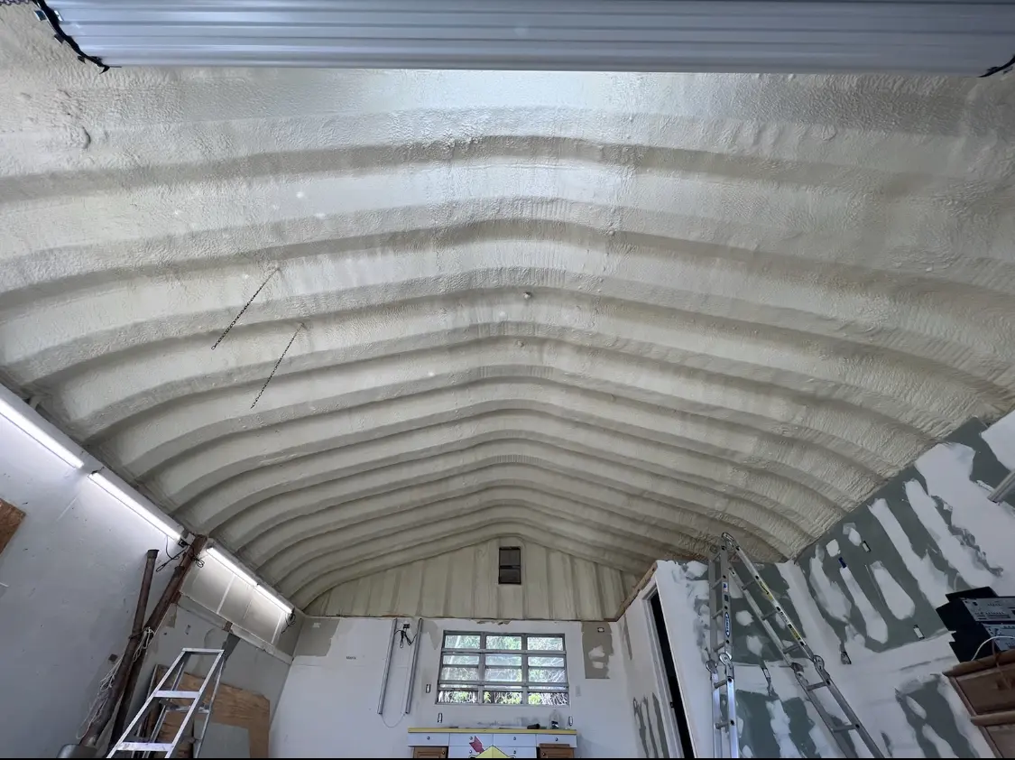 Spray polyurethane foam applied to the underside of a metal roof deck in Kendale Lakes